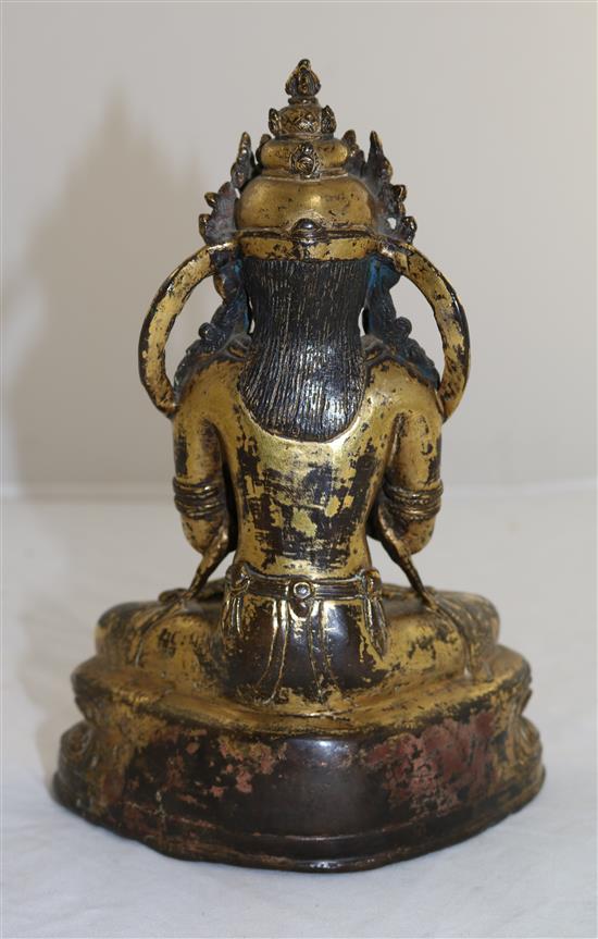 A Nepalese gilt copper alloy jewelled figure of Vajradhara, early Malla period, 15th century, height 20.3cm, later paste and stone ca